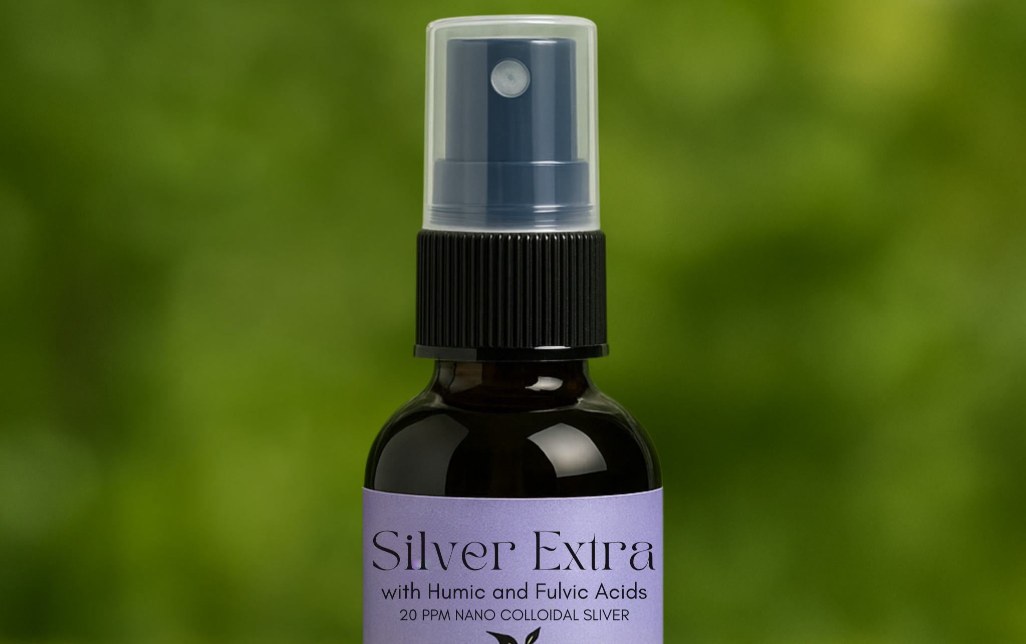 A bottle of Colloidal Silver Extra with Humic and Fulvic Acid Spray by EPIC MINERALS on a mossy surface with a blurred green background.